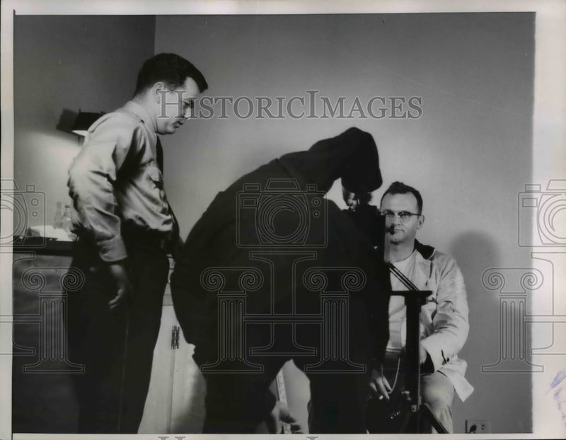 Load image into Gallery viewer, 1958 Press Photo Chicago policeman George Michaletti sits in front of camera
