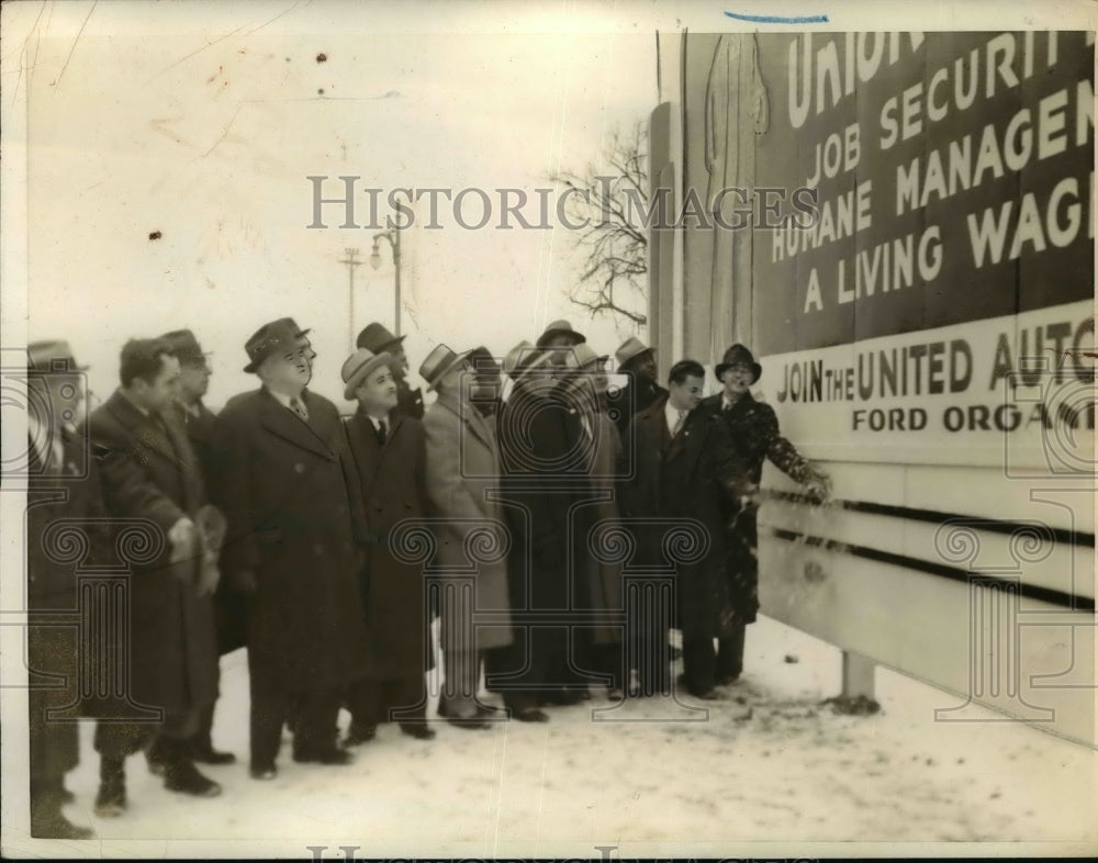 1938 Press Photo United Auto Workers Christens Billboard with Beer Bottle