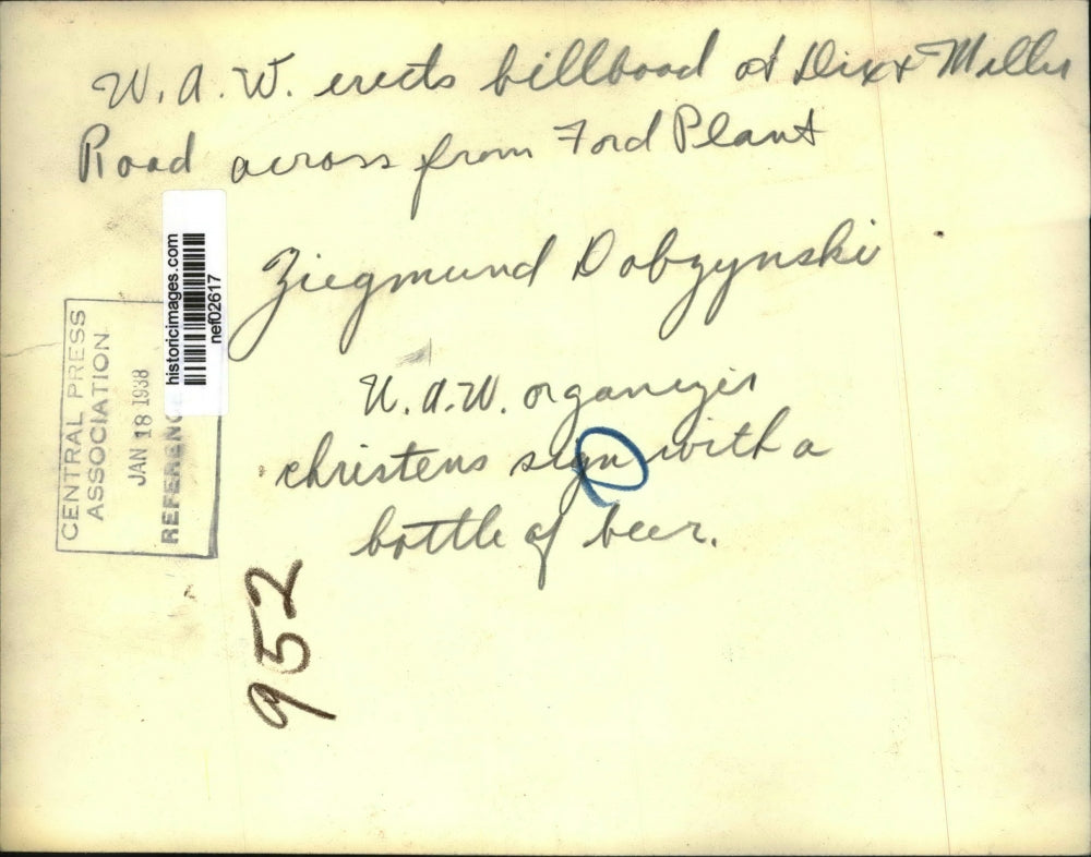 1938 Press Photo United Auto Workers Christens Billboard with Beer Bottle