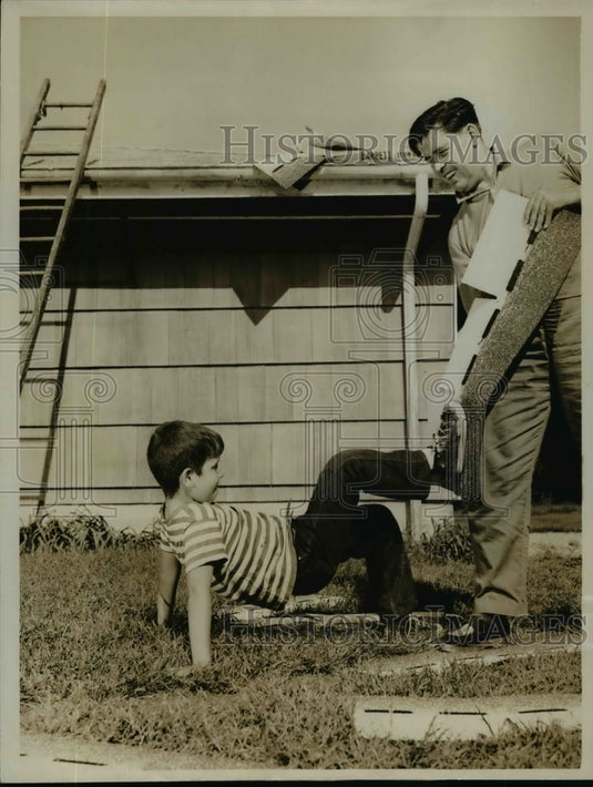 1961 Press Photo Alex MacLean & his son Peter test shingle adhesive - nef03002