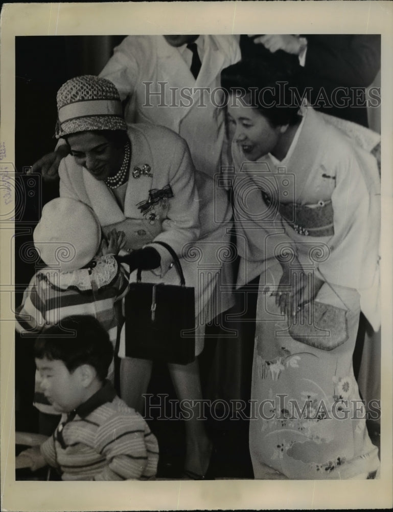 Load image into Gallery viewer, 1964 Press Photo Iranian Princess Shams Pahvali plays with girl - nef03243
