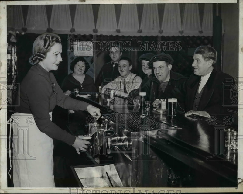 Load image into Gallery viewer, 1941 Press Photo Barmaid serves drinks to patrons - nef04330
