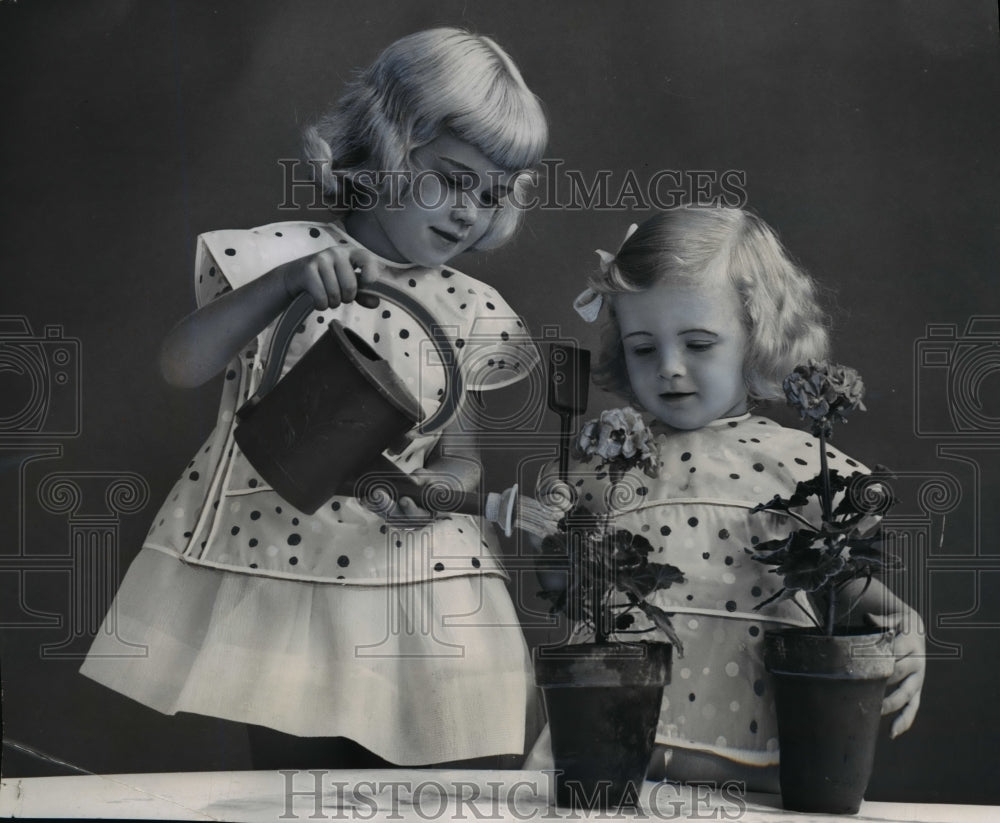1955 Press Photo Plastics cover up bids for small fry dresses - nef04473