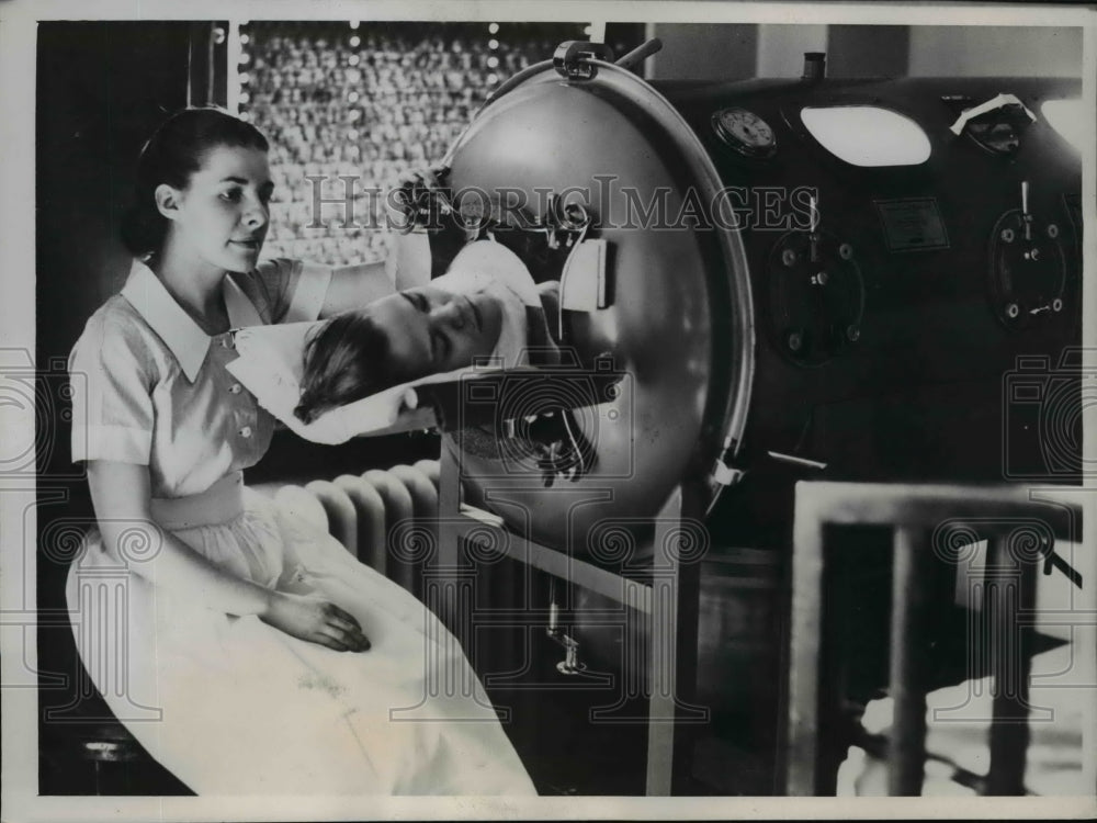 1938 Press Photo Eugenia Davis lies in respiratory after spinal operation