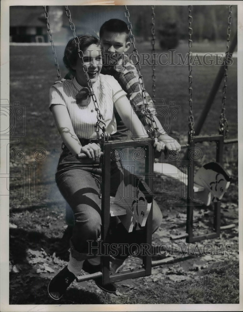 Load image into Gallery viewer, 1955 Press Photo High School Couple on Swing Set - nef06779

