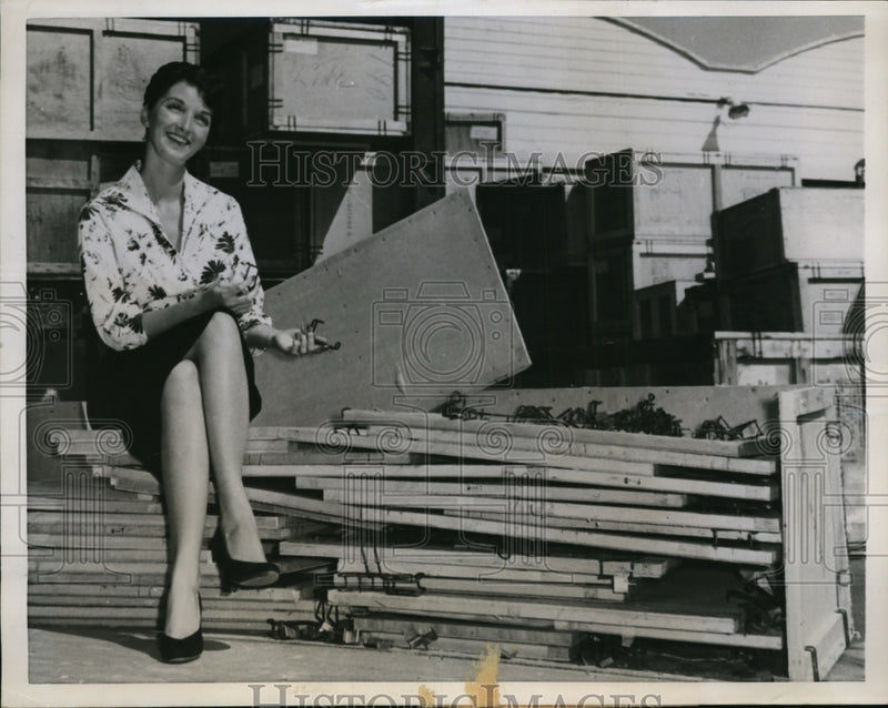 Load image into Gallery viewer, 1957 Press Photo Ramona Ridling shows invention that saves millions of dollars

