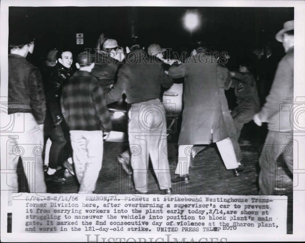 1956 Press Photo Pickets Overturn Car To Prevent Carrying Workers Into The Plant