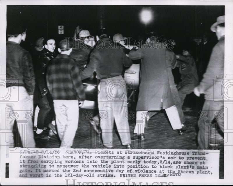 Load image into Gallery viewer, 1956 Press Photo Pickets Overturn Car To Prevent Carrying Workers Into The Plant
