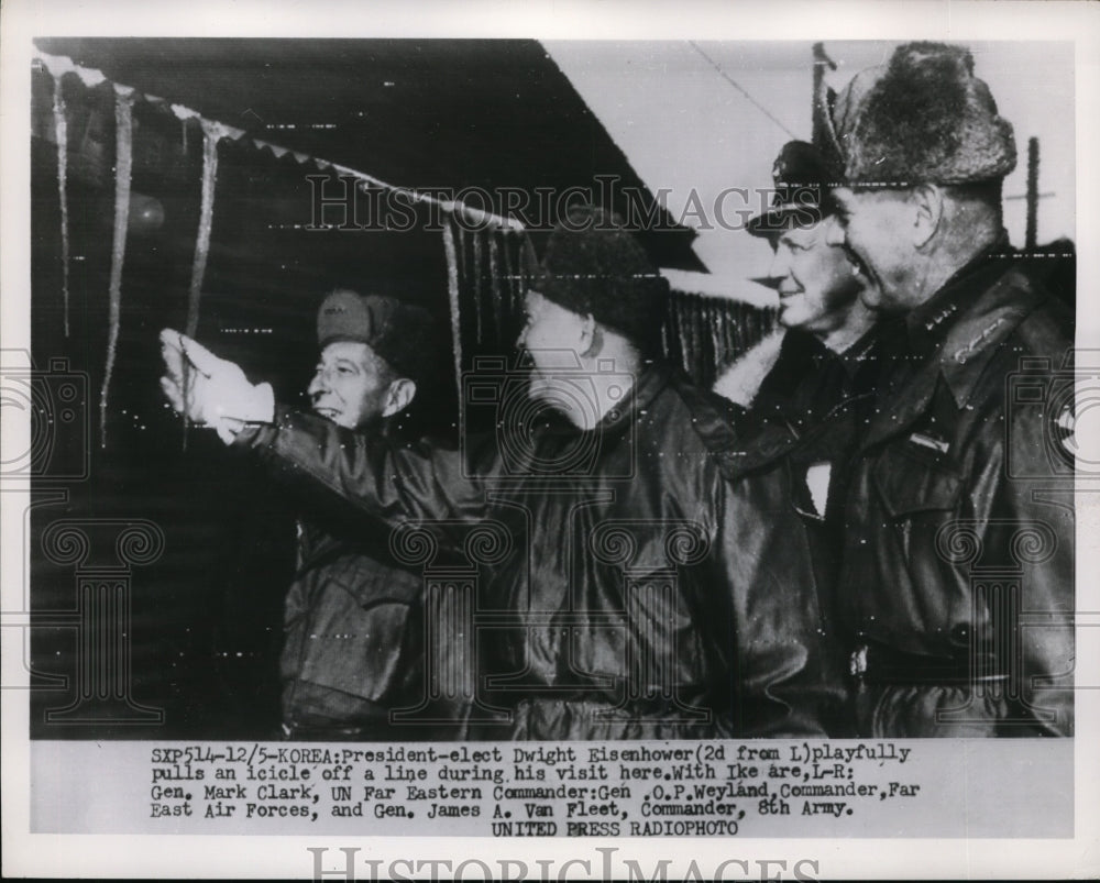 1952 Press Photo Pre Eisenhower Playfully Pulls An Icicle Off Line Here in Korea