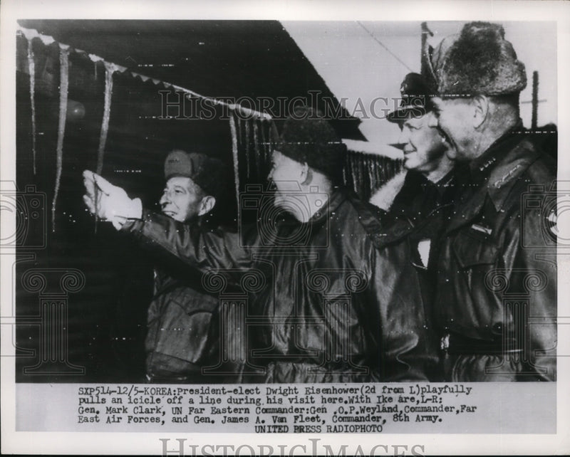 Load image into Gallery viewer, 1952 Press Photo Pre Eisenhower Playfully Pulls An Icicle Off Line Here in Korea
