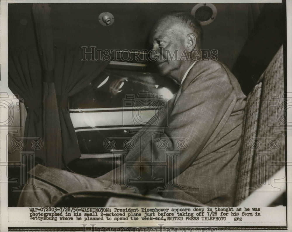 1956 Press Photo Eisenhower In Deep Thought In His Small Plane Traveling To Farm