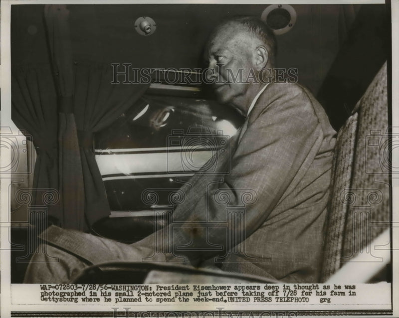 Load image into Gallery viewer, 1956 Press Photo Eisenhower In Deep Thought In His Small Plane Traveling To Farm
