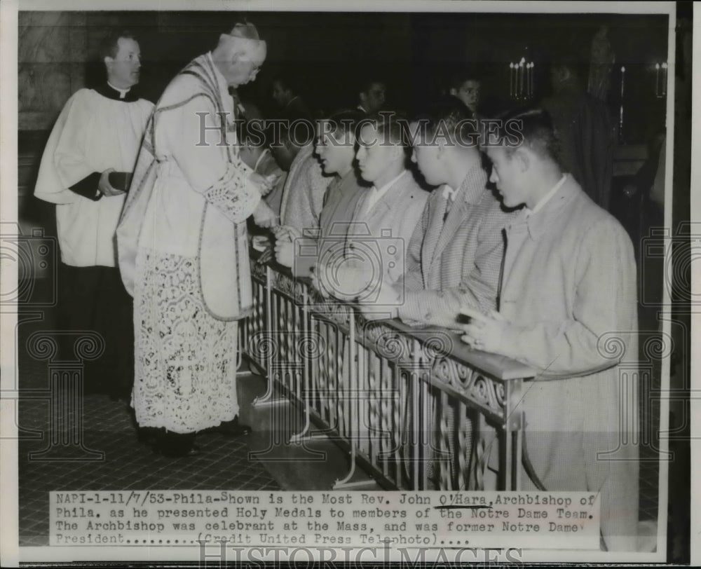 1953 Press Photo Rev O'Hara Presents Holy Medals to Members of Notre Dame Team