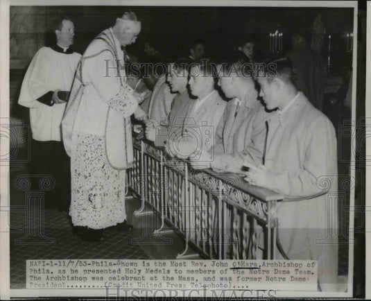1953 Press Photo Rev O'Hara Presents Holy Medals to Members of Notre Dame Team