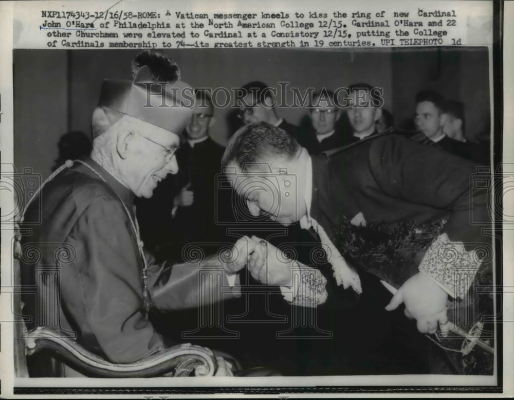 1958 Press Photo Vatican messenger kneels to kiss ring of John O'Hara