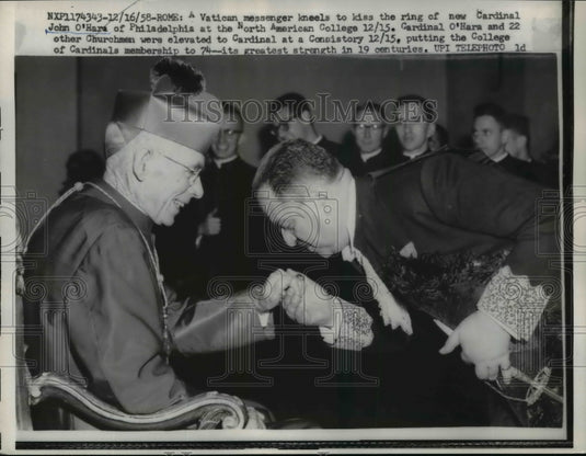 1958 Press Photo Vatican messenger kneels to kiss ring of John O'Hara