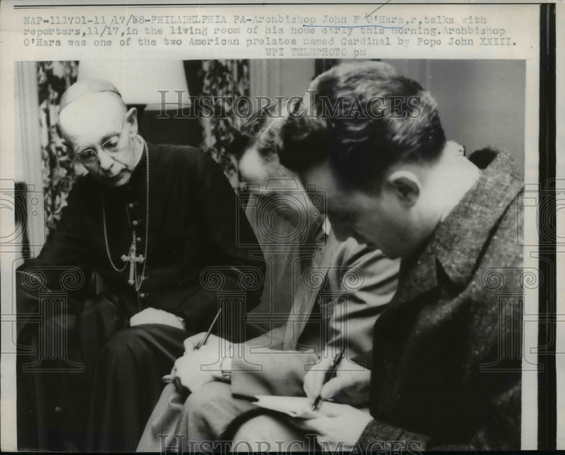 Load image into Gallery viewer, 1958 Press Photo O'Hara talks with reporters in living room of his home
