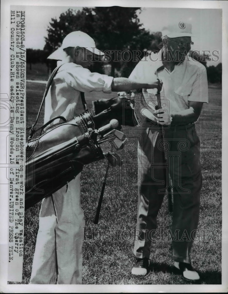 1955 Press Photo Pres Eisenhower Is Shown Selecting An Iron On the First Green