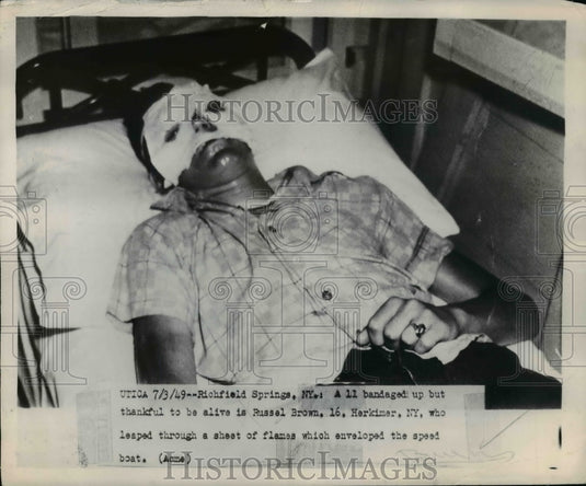 1949 Press Photo Russel Brown of N.Y leaped through flame from speed boat