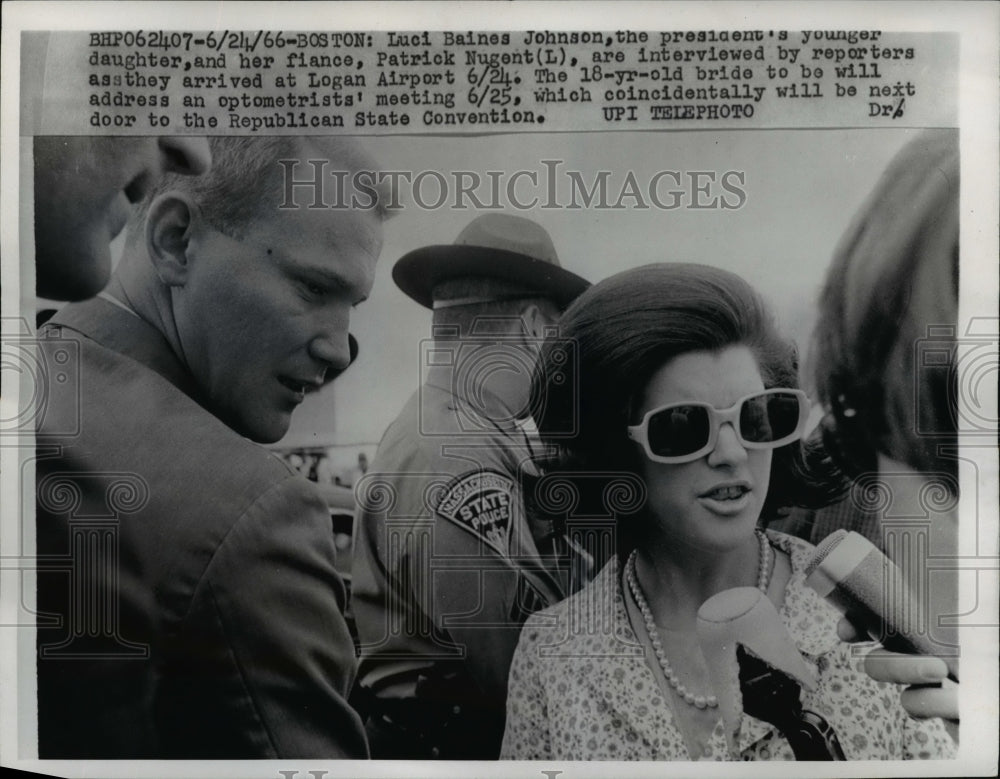 1966 Press Photo Luis Johnson & Fiance Interviewed By Reporters At Logan Airport