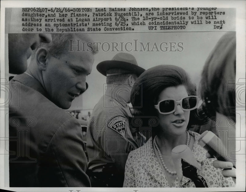 Load image into Gallery viewer, 1966 Press Photo Luis Johnson &amp; Fiance Interviewed By Reporters At Logan Airport
