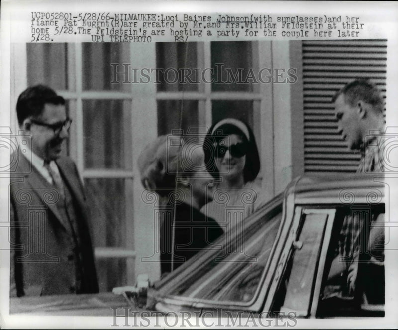 Load image into Gallery viewer, 1966 Press Photo Luci Johnson and Her Fiance Are Greeted By Mr &amp; Mrs W Feldstein
