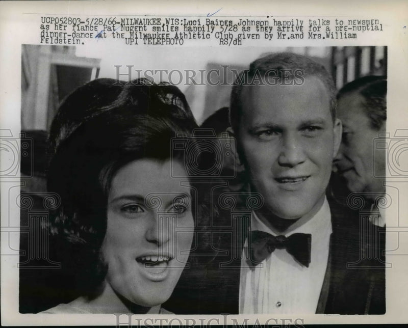 Load image into Gallery viewer, 1966 Press Photo Luci Johnson talks to newsmen as her fiance Pat Nugent smiles
