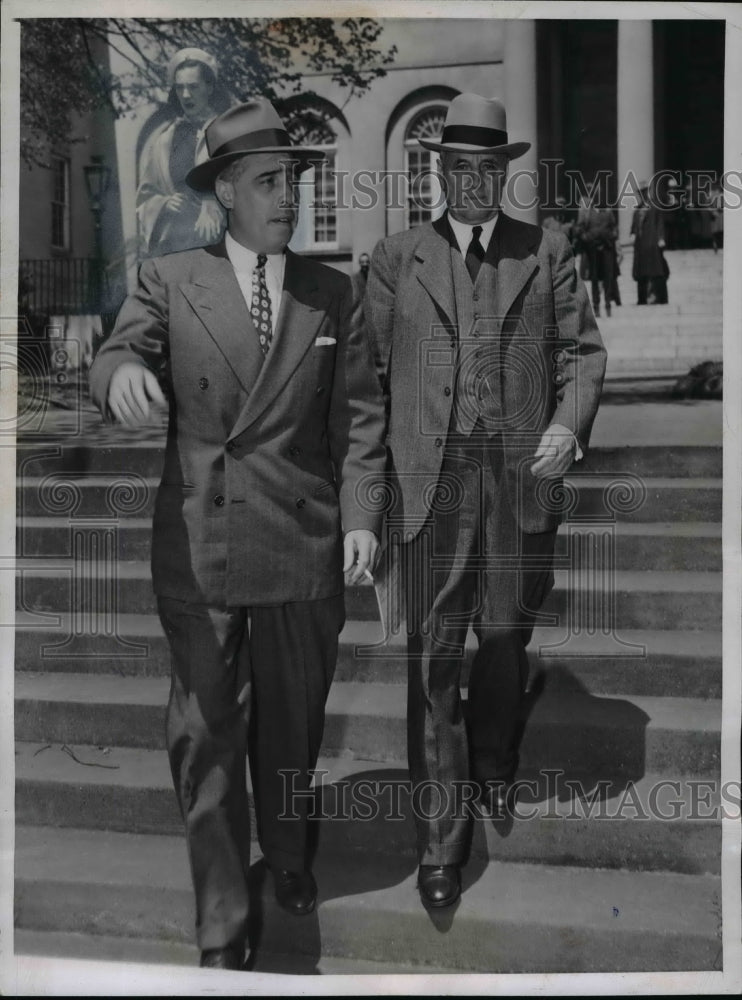 Load image into Gallery viewer, 1947 Press Photo May and Son Leave Federal Court of The May-Garsson Fraud Trial
