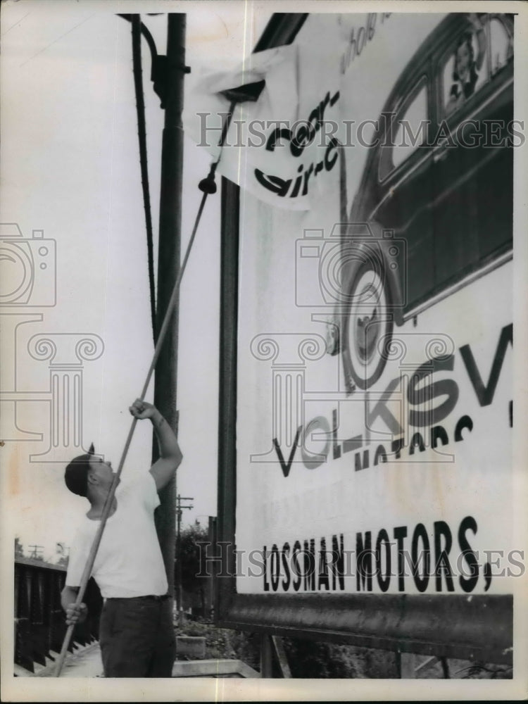 1959 Press Photo Man Posting Billboard - nef15475