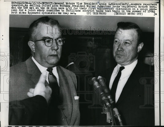 1963 Press Photo Louis Seaton Answers Questions as Walter Reuther Looks On