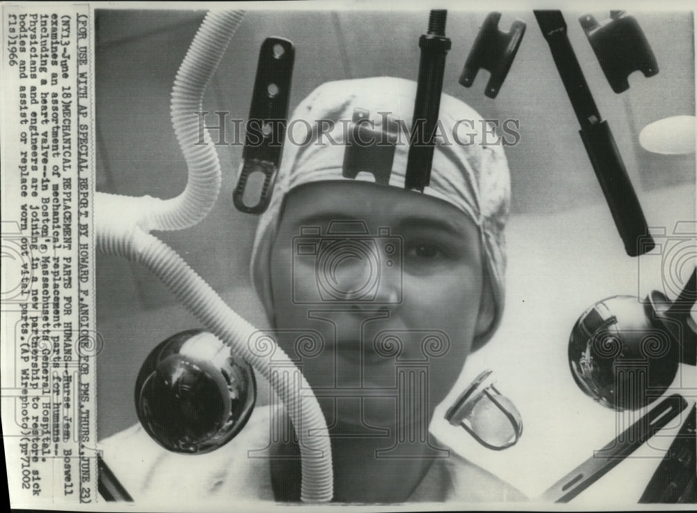 1966 Press Photo Nurse Jean Boswell Examines Assortment of Mechanical Parts