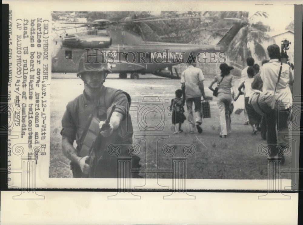 1975 Press Photo With U.S. Marines For Cover Americans & Cambodians Board Plane