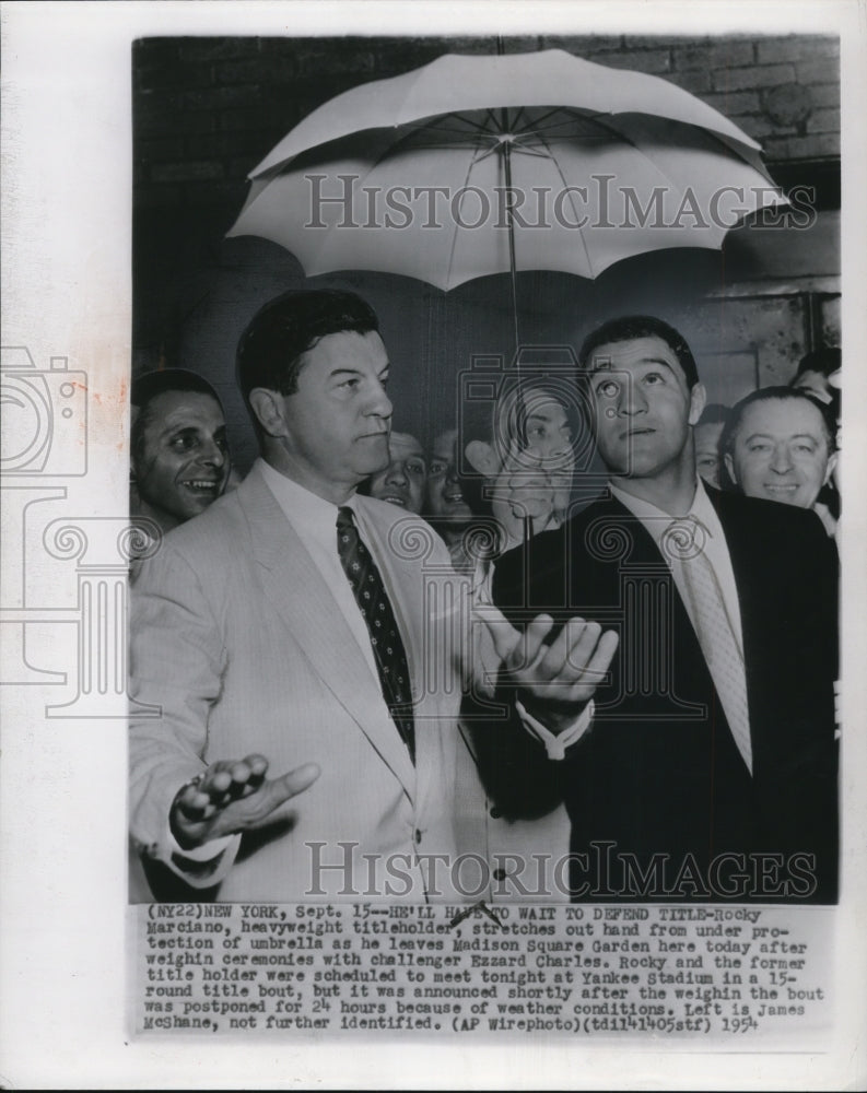 Load image into Gallery viewer, 1954 Press Photo Rocky Marciano, heavyweight titleholder leaves Madison Square
