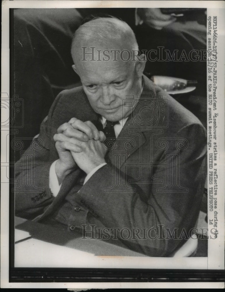 1957 Press Photo Pres Eisenhower Strikes Reflective Post During Opening Session