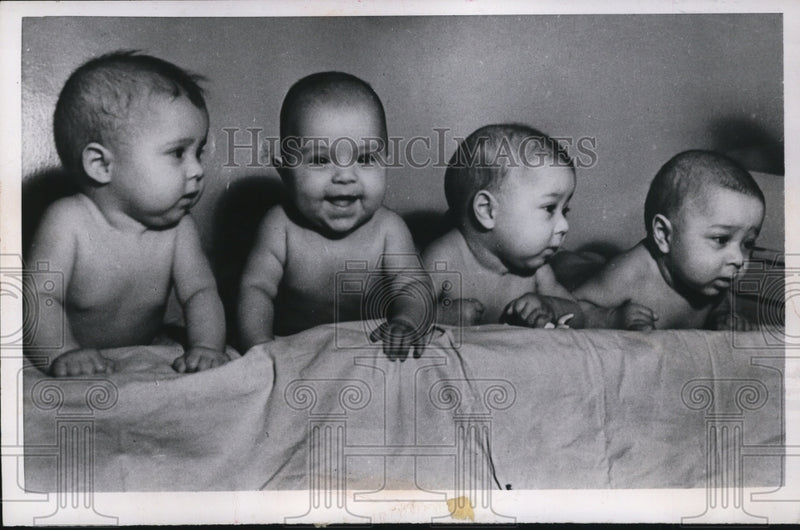 Load image into Gallery viewer, 1957 Press Photo Vyugin Quadruplets from Russia - nef24610
