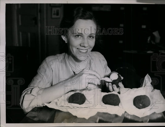 1936 Press Photo Claire Vernon with 400 Year-Old Eggs from China at Food Show
