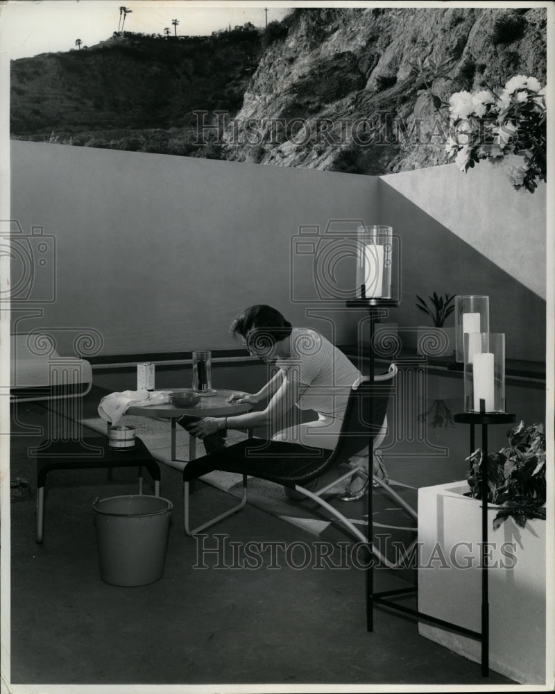 1962 Press Photo woman Washing Outdoor Furniture - nef26753