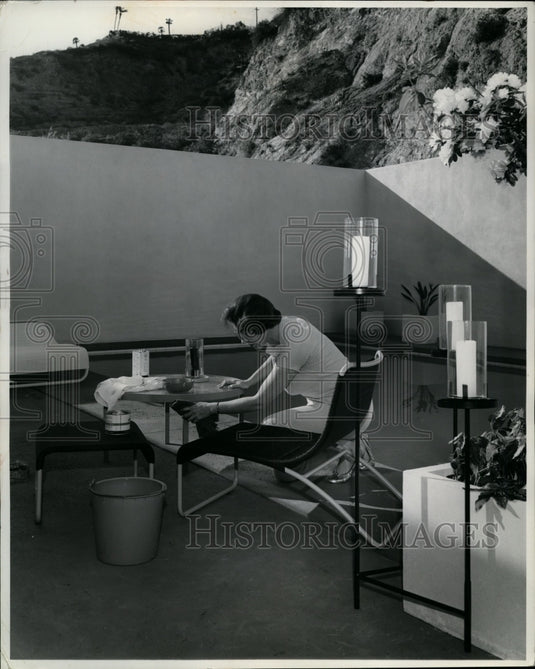 1962 Press Photo woman Washing Outdoor Furniture - nef26753