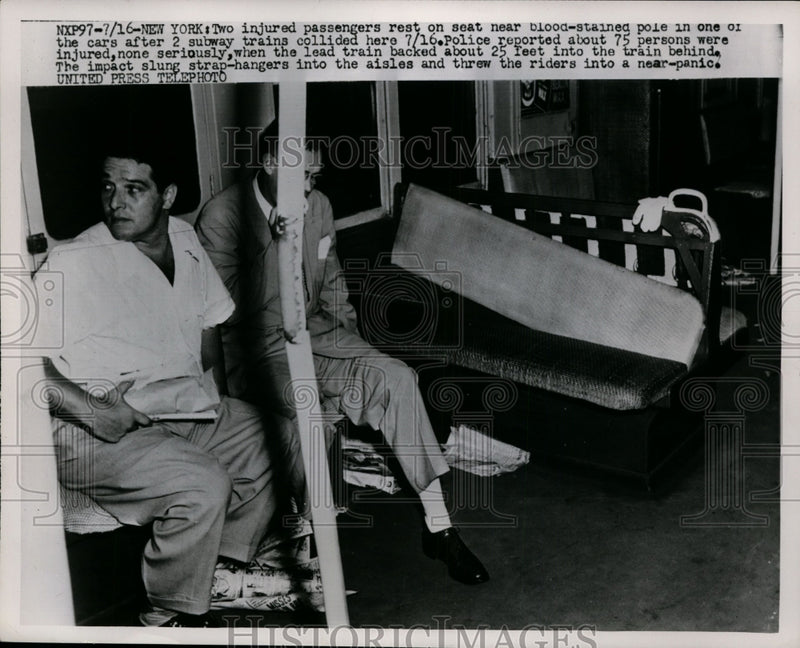 Load image into Gallery viewer, 1952 Press Photo Two injured passengers rest on seat near blood-stained pole
