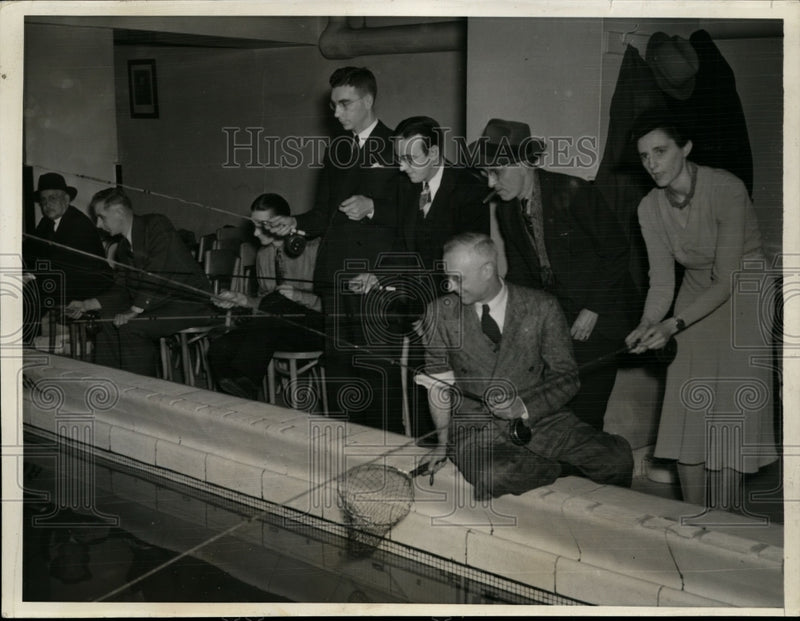 Load image into Gallery viewer, 1941 Press Photo National Outdoor Sports Show Fishermen Catch in Chicago Pool
