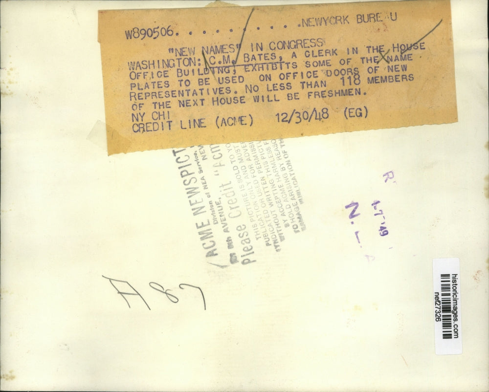 1948 Press Photo C.M. Bates Exhibits Some of The Name Plates For Office Doors