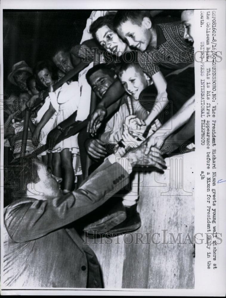Load image into Gallery viewer, 1960 Press Photo Vice President Richard Nixon greets youths at the Coliseum
