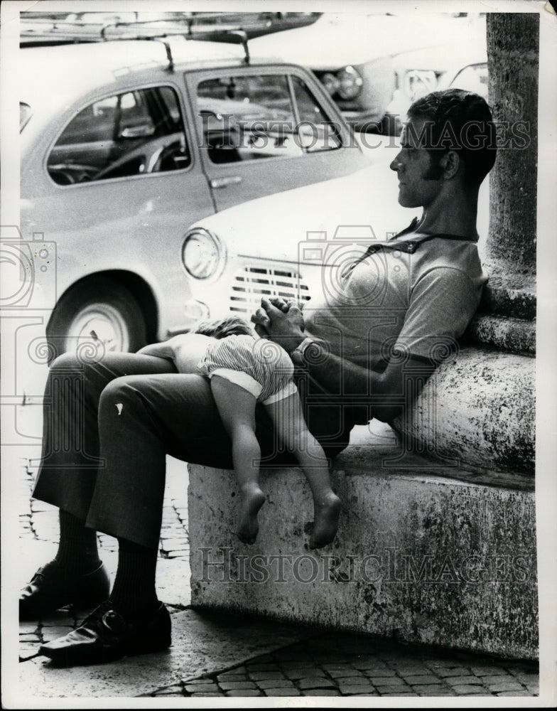 Load image into Gallery viewer, Press Photo Father Holds Napping Child at St Peters Square in Vatican City
