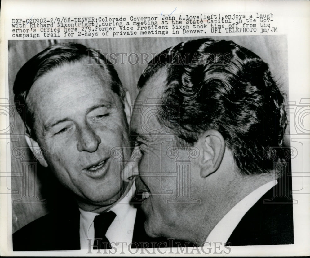 1968 Press Photo John Love laughing with Richard Nixon during a meeting