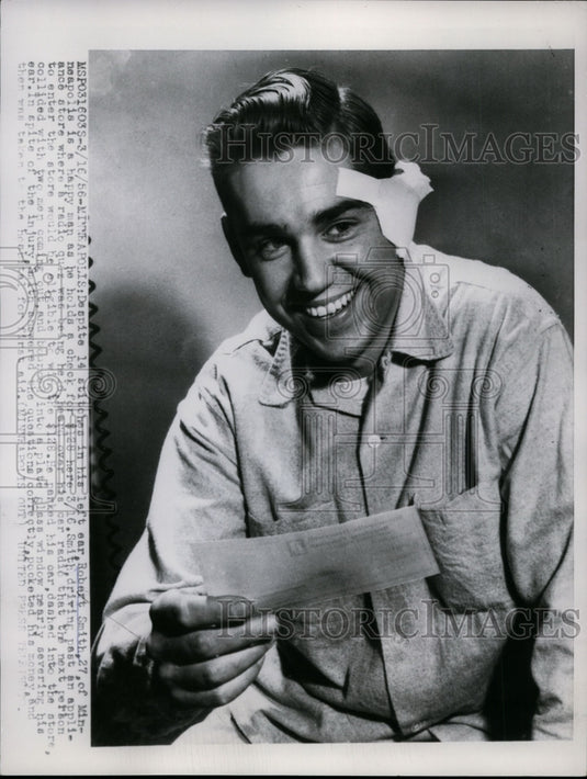 1956 Press Photo Robert Smith holds a check for winning in the radio quiz