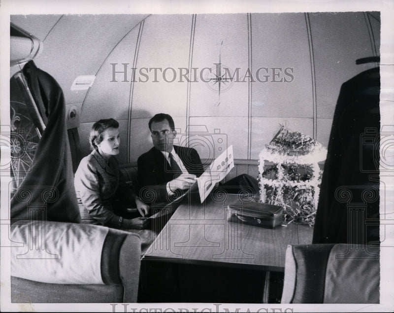 Load image into Gallery viewer, 1956 Press Photo Richard Nixon, Wife Pat Aboard Campaign Plane - nef28670
