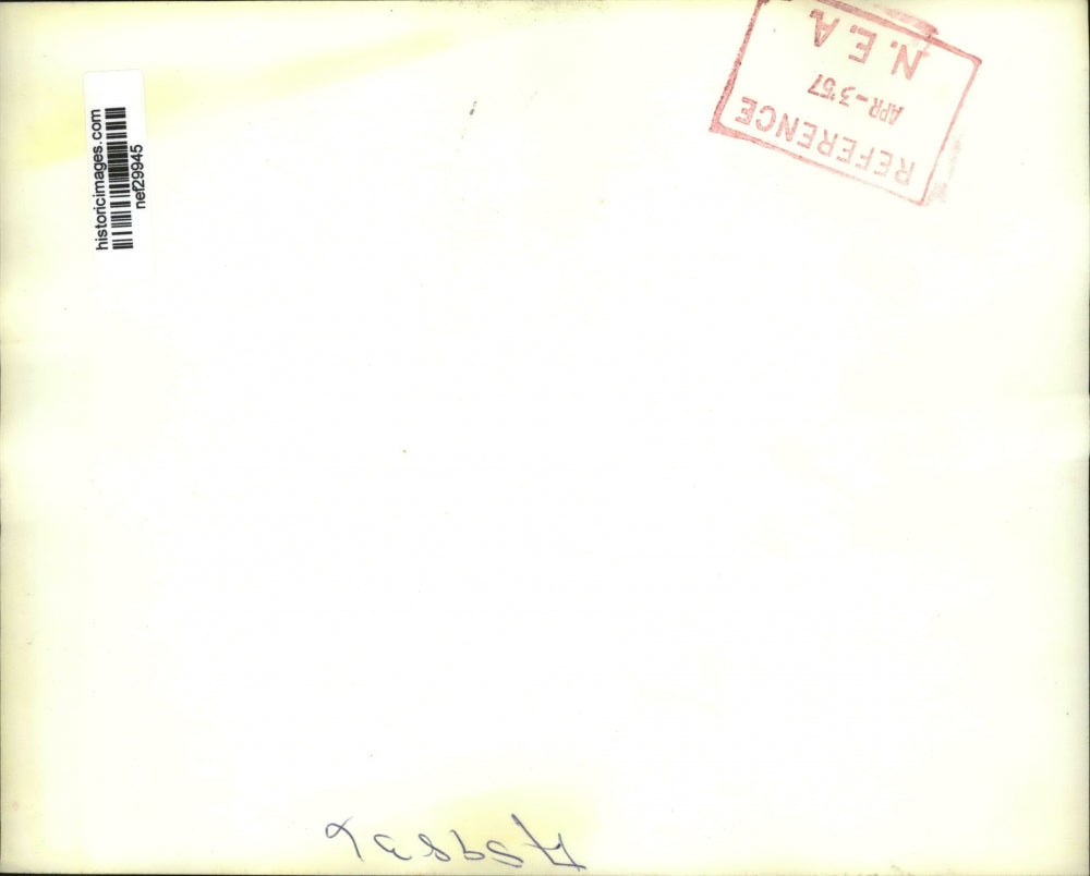 1957 Press Photo With an unlit cigarette dangling, C.E. Wilson Meets the Press