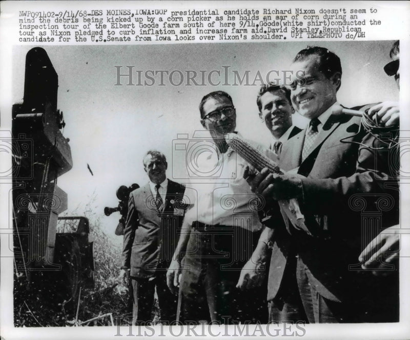 Load image into Gallery viewer, 1968 Press Photo Candidate Nixon Doesn't Mind Flying Debris as He Inspects Farm
