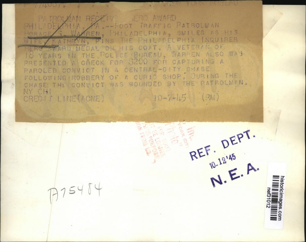 1945 Press Photo Horace S Warren as Wife Kathryn Pin Hero AWard Medal on Coat