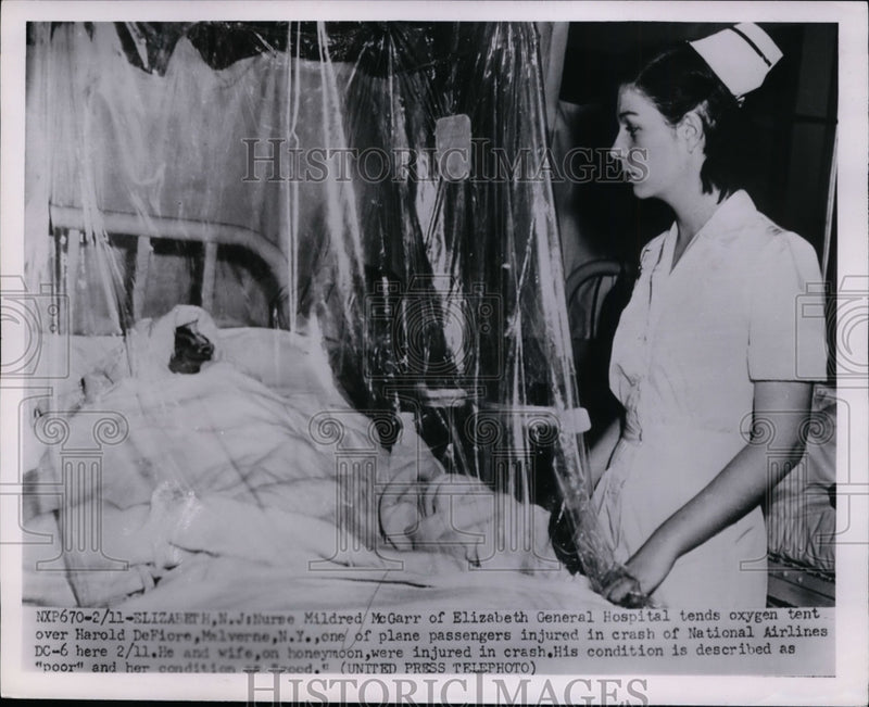 Load image into Gallery viewer, 1952 Press Photo Harold DeFiore in Elizabeth General Hospital after Plane Crash
